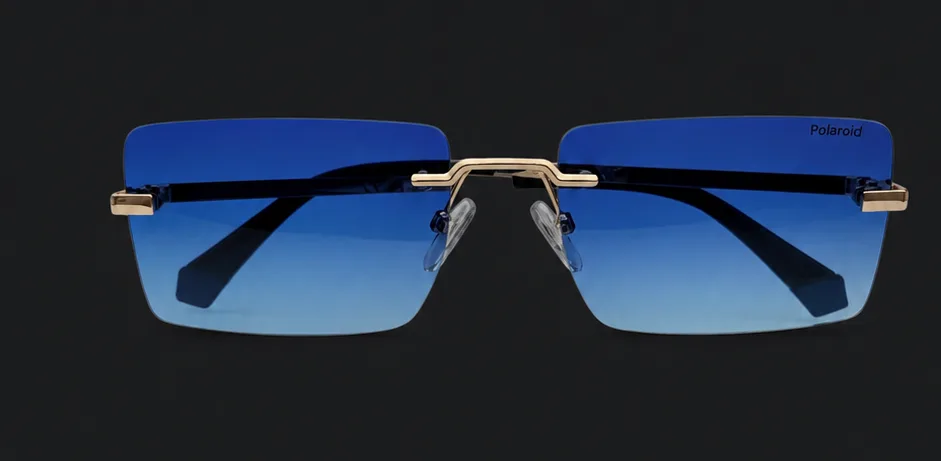 Ochelari de soare Polaroid rimless cu lentilă albastră degradé, vedere frontală, disponibili la ArenaMed Optics