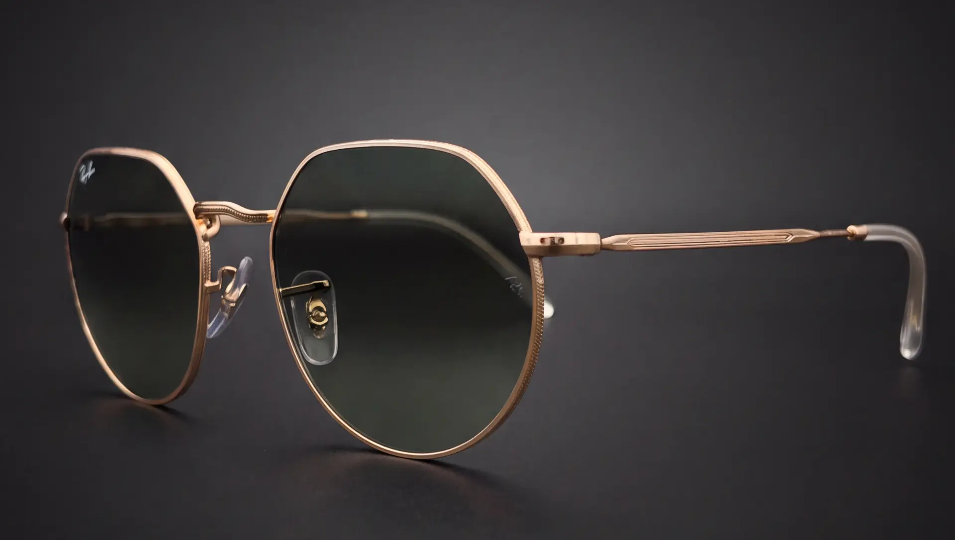 Ochelari Ray-Ban Jack văzuți din profil, ramă hexagonală rose gold